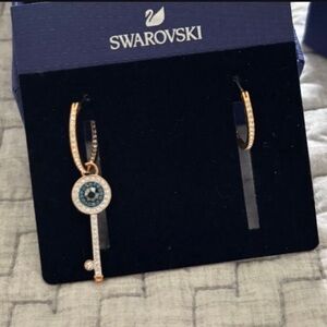 Swarovski rose Gold hoops with a beautiful Evil Eye Key pendant.